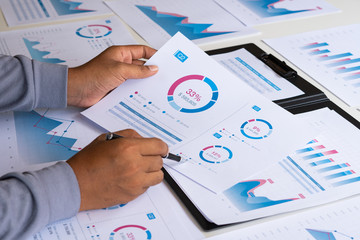 Poster - businessman working calculate data document graph chart report marketing research development planni