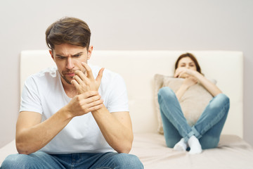 couple sitting on sofa and watching tv