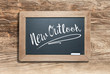 © Andy Dean - New Outlook Written on Slate Chalk Board Against Aged Wood and Background