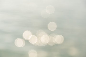 Wall Mural - Abstract photo blurred of out of focus of water under sunlight with bokeh using for wallpaper or background