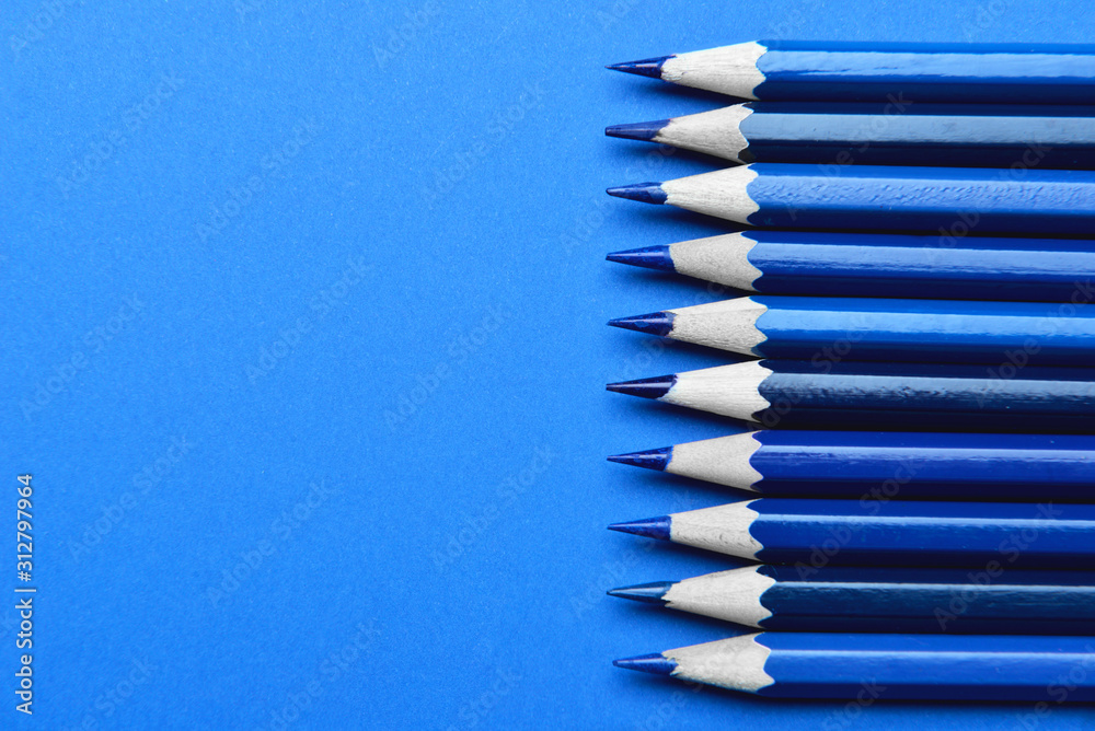 Blue pencils on color background