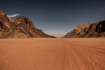 Wadi Rum Desert in Jordan. On the Sunset. Panorama of beautiful sand pattern on the dune. Desert landscape in Jordan.