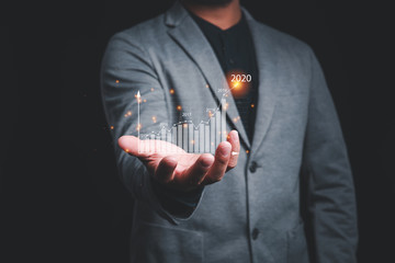 Aufkleber - business man holding graph virtual screen.plans to increase business growth and an increase in the indicators of positive growth in 2020.