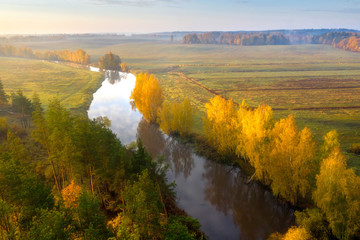 Fototapete - Autumn landscape of river aerial view. Autumn forest and fields. Sunrise over river