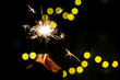 © DG PhotoStock - Girl enjoy playing with a small sparkler hand fireworks, celebrating in Christmas and New Year festival.