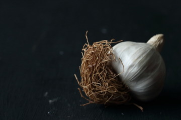 garlic, organic natural garlic on a black background