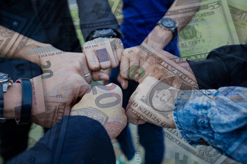 Double exposure Business people of Marketing team  with a Partnership Team Giving Fist Bump and currency of money savings team concept