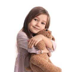 Poster - Portrait of cute little girl with toy bunny on white background