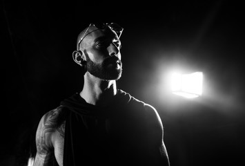 B/W male portrait at dark background