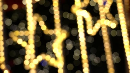 Wall Mural - Stars from electric garlands. Winking light spots on a black background.