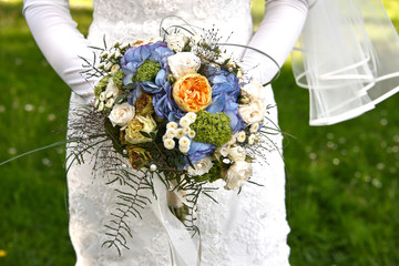 Wall Mural - bride holding wedding bouquet