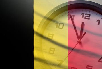 Wall Mural - belgium flag with dial of a clock