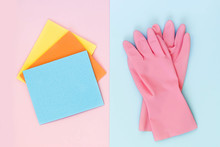 Pink Rubber Glove And Rags On A Pink And Blue Background. Cleaning Service Concept. Top View, Flat Lay.