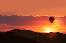 Beautiful Sunset And Mountains. Balloon Flying On The Sunset Sky.