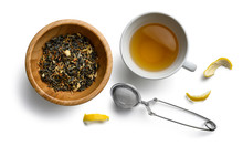 Green Tea With Natural Aromatic Additives And A Cup Of Tea. Top View On White Background