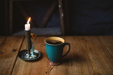 Black Coffee And Candle On Table