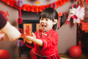 Wall Mural - Chinese baby girl  traditional dressing up with a 