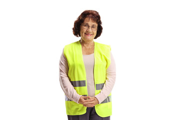 Poster - Elderly woman with a safety vest smiling at the camera