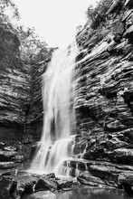 Black And White Photo Of Waterfall Flowing Over Rocky Wall In Brazilian Jungle