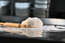 Bread Dough And Flour With A Rolling Pin