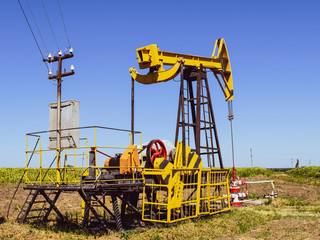 Wall Mural - Pumping unit as the oil pump installed on a well