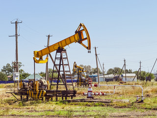 Wall Mural - Pumping unit as the oil pump installed on a well