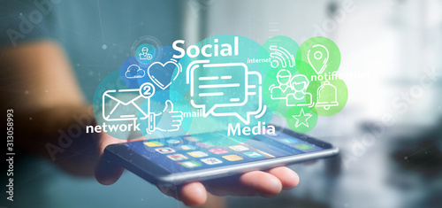 Cuadros en Lienzo Businessman holding a cloud of social media network icon