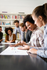 Business people, architects having discussion and working in office