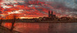 Panoramic view of beautiful bloody sunset in front of Cathedral of Magdeburg, downtown and river Elbe, Magdeburg, Germany, Winter, red cloudy sky
