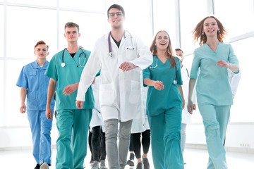 group of hilarious doctor interns showing thumbs up