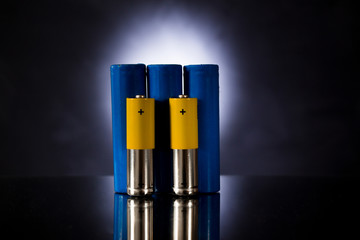 three large blue rechargeable batteries and two yellow small ones.