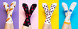 Female legs in colorful socks on colored background