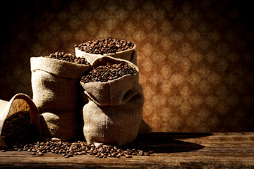 Sticker - Fresh coffee beans in sack and free space for your decoration. 