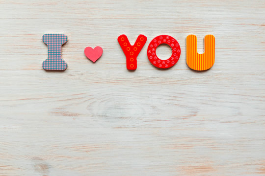 Inscription I love you written in wooden made letters on wood vintage background