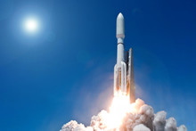 Take Off Space Rocket On A Background Of Blue Sky And Sun. Elements Of This Image Were Furnished By NASA