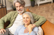© Viacheslav Yakobchuk - Loving middle-aged man embracing his pleased wife