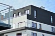 © Grand Warszawski - Contemporary residential building exterior in the daylight. Modern apartment buildings on a sunny day with a blue sky. Facade of a modern apartment building