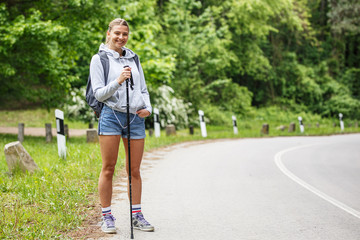 Wall Mural - portrait of young blond hair female hiker.