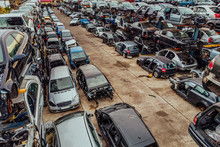 Damaged Cars Waiting In A Scrapyard To Be Recycled Or Used For Spare Parts