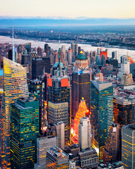 Wall Mural - Aerial panoramic view. on Midtown district of Manhattan in New York. Hudson river is on the background. Metropolitan City skyline, USA. American architecture building. Panorama of Metropolis NYC