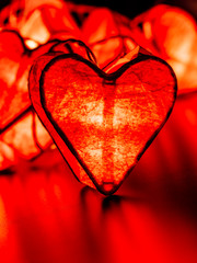 Close up of glowing red valentine heart decoration light