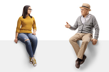 Wall Mural - Grandfather and granddaughter on a panel having a conversation