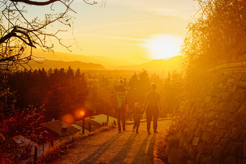 Romantic sunset and family on pathway at old vineyards in Maribor in Slovenia in Lower Styria in Europe. Nature in spring in Slovenija. Slovenian city in summer. Vine cesta on Piramida or Pyramid hill