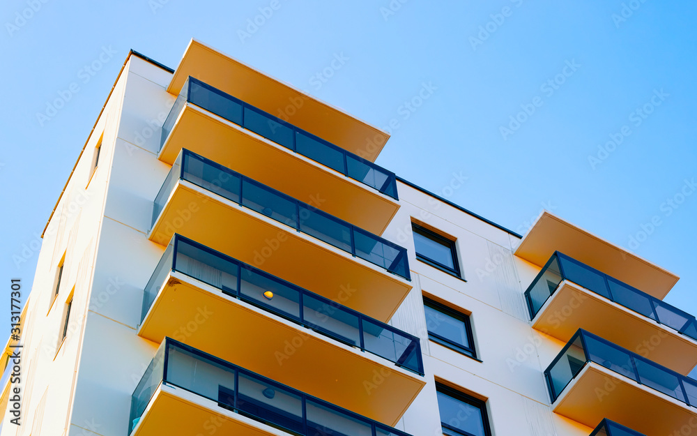 Apartment in residential building exterior. Housing structure at blue modern house of Europe. Rental home in city district on summer. Architecture for business property investment, Vilnius, Lithuania. - obrazy, fototapety, plakaty 