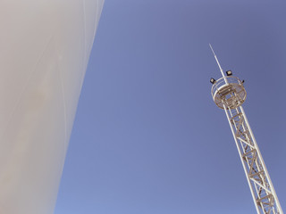 Wall Mural - White tank and tower lighting on the sky background.