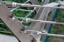 Structural Details Of Iron Mounts Of Frameless Glass Bridge Close Up.