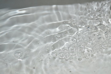 Canvas Print - The surface of the water in a white container