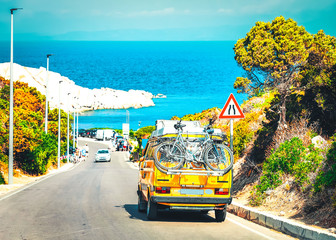 Canvas Print - Camper in the road at Capo Testa in Santa Teresa Gallura at the Mediterranean Sea on Sardinia Island in Summer Italy.