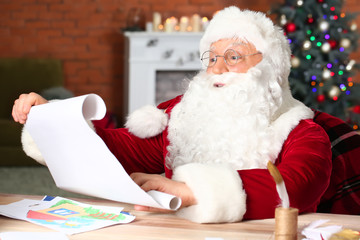 Poster - Santa Claus reading wish list in room decorated for Christmas