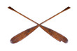 A pair of old, well-used, partially broken oars isolated on a white background